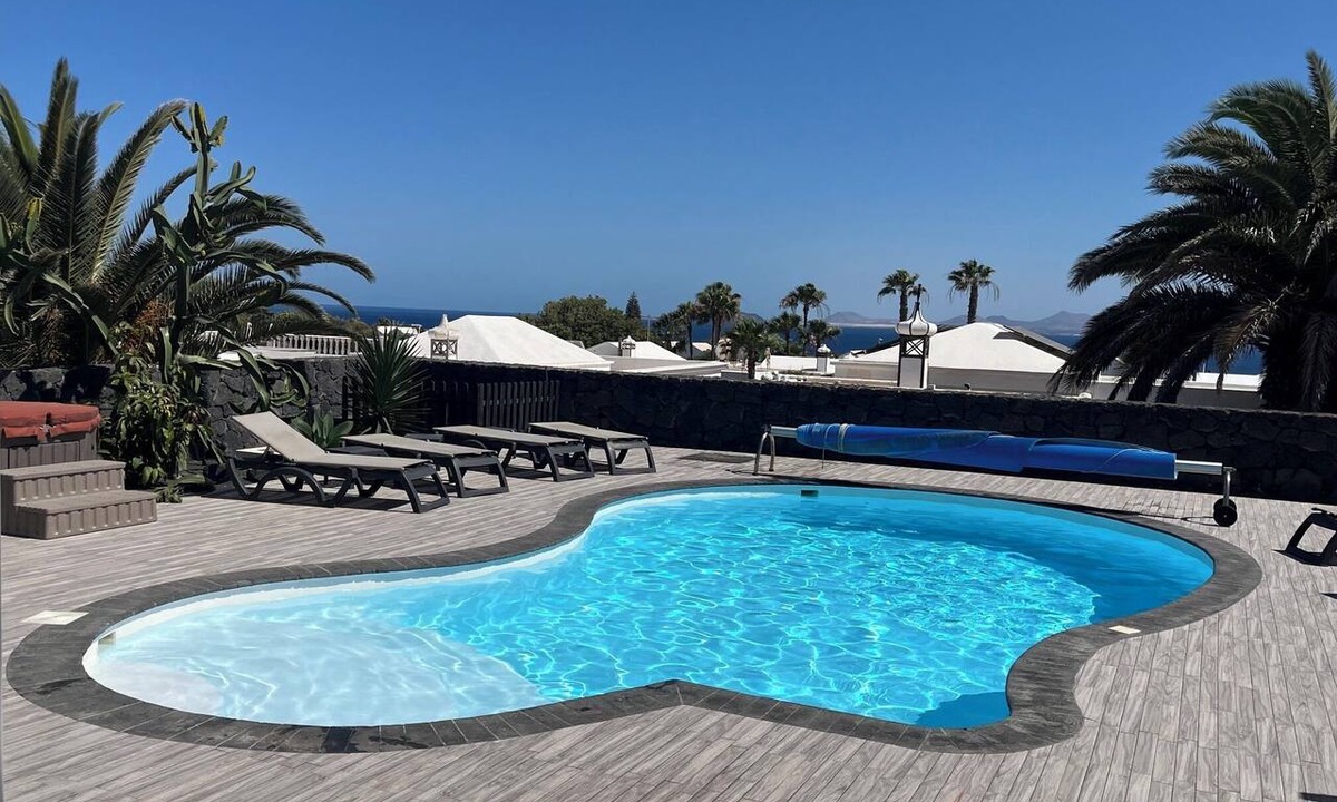 Playa Blanca Villa | Amazing sea and mountain views, heated pool and jacuzzi, aircondition