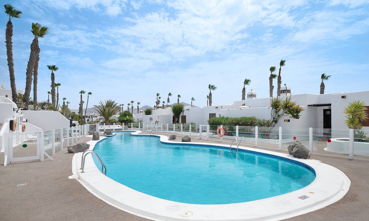 Playa Blanca Apartment | Apartment "Puerto Chico E" with Sea View, Shared Pool, Terrace & Wi-Fi