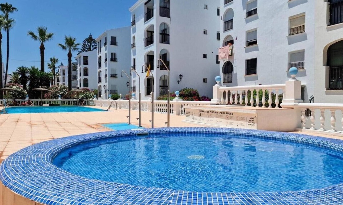 San Luis de Sabinillas Apartment | Beautiful beachfront 2 bedroom apartment with garage, swimming pool, fast wifi, garden, 30m to beach