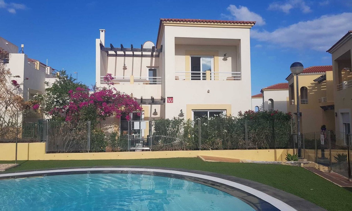 Caleta de Fuste Villa | Poolside villa with private access from terrace in secure gated community.