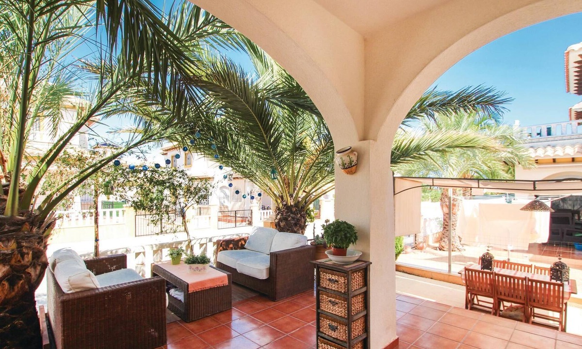 La Marina House | This beautiful vacation townhouse in La Marina, on the Costa Blanca, offers access to a communal poo