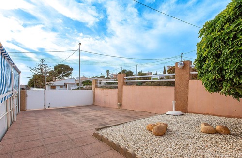 Isla Plana Apartment | Enjoy a relaxing vacation by the sea in this vacation apartment with a beautiful conservatory.