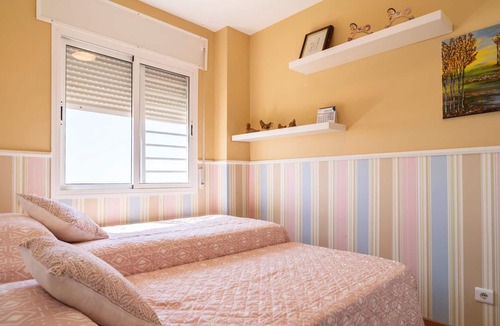 Benagalbon Apartment | Look forward to this family-friendly and colorful vacation apartment with sea view.