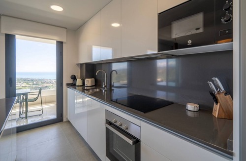 Rincon de la Victoria Apartment | Modern Costa Living: Sleek Three-Bedroom Apartment with Shared Pool & Fitness Center