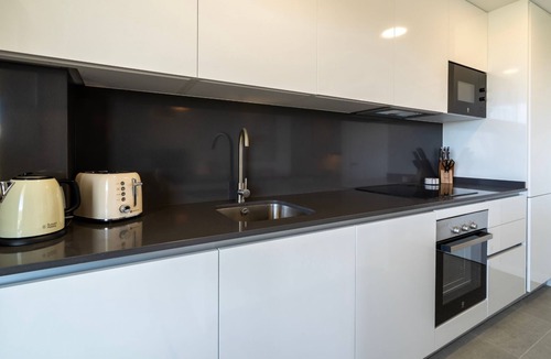 Rincon de la Victoria Apartment | Modern Costa Living: Sleek Three-Bedroom Apartment with Shared Pool & Fitness Center