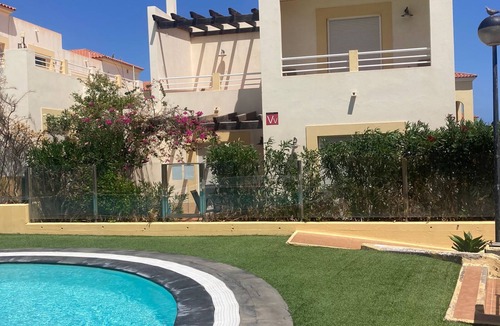 Caleta de Fuste Villa | Poolside villa with private access from terrace in secure gated community.