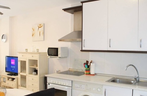 La Envia Apartment | Swimming pools, gym, library and golf course. Wifi in common areas. Heated swimming pool.