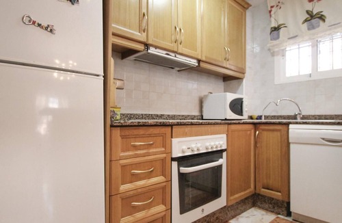 La Marina House | This beautiful vacation townhouse in La Marina, on the Costa Blanca, offers access to a communal poo
