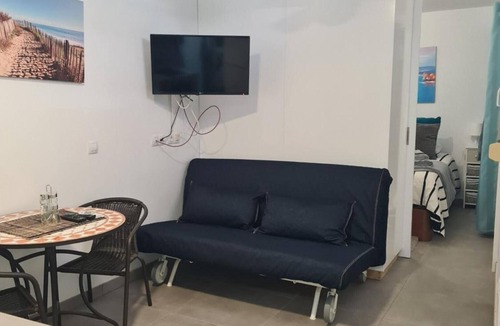 Playa de Arinaga Apartment | Vacation 'Casa Paula - 22' with Mountain View, Shared Pool and Wi-Fi