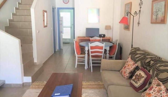 A beautiful 2-bedroom south-facing townhouse five-minutes walk from the beach