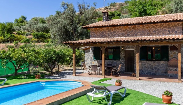 Charming farmhouse among orange trees