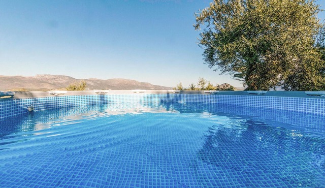 Enjoy the beautiful mountainous landscape during a vacation in this vacation home on the border of t