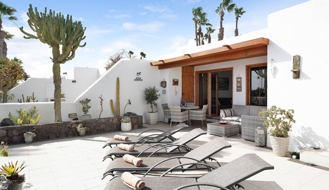 Front-Line Holiday Bungalow "Puerto Chico T" with Mountain & Sea Views, Shared Pool & WiFi