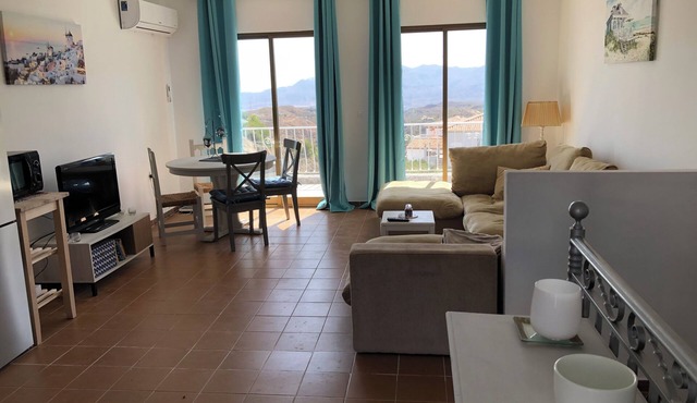 Lovely two bedroom villa. South facing sunny private terrace. Very accessible