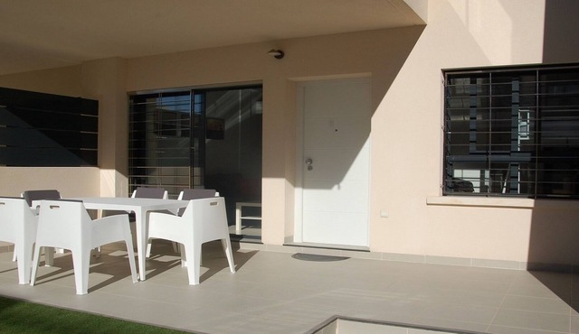 Modern apartment 250 m from the sea with south facing terrace and swimming pool