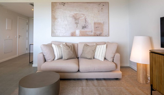 Modern Costa Living: Sleek Three-Bedroom Apartment with Shared Pool & Fitness Center