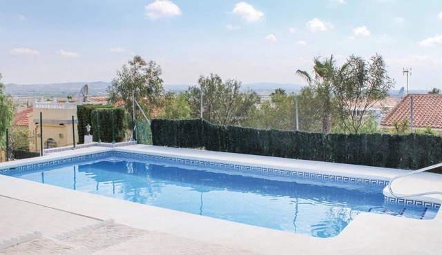 This beautiful vacation detached house in a quiet location in the popular urbanization 'La Marina',