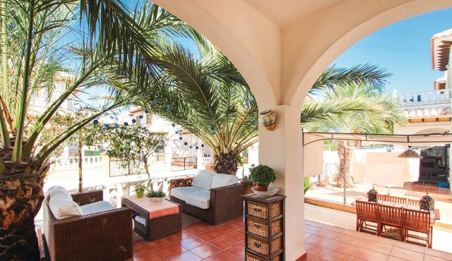 This beautiful vacation townhouse in La Marina, on the Costa Blanca, offers access to a communal poo