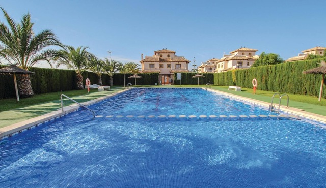 This beautiful vacation townhouse in La Marina on the Costa Blanca offers access to a communal pool