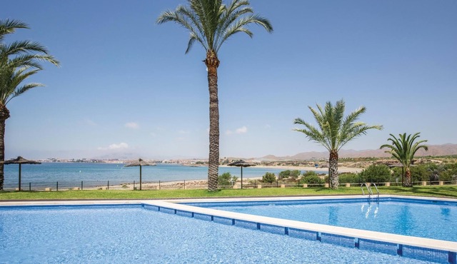 This vacation apartment with modern equipment offers a magnificent view of the sea and the huge pool
