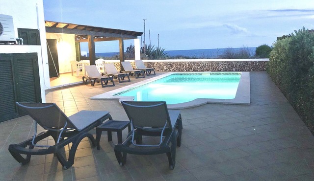 Tourist Villa in Binibeca. Seafront and heated pool with aircon in bedrooms.