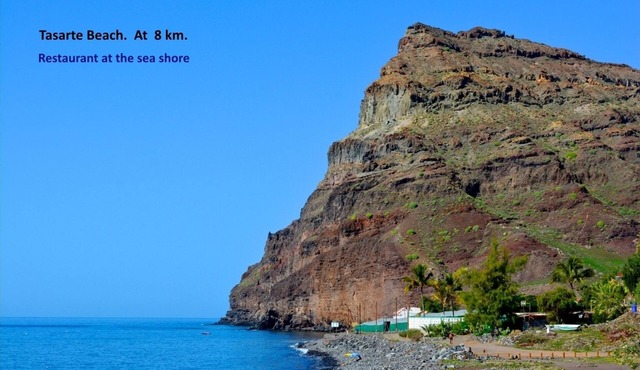 Villa with private pool in a valley under the sun and palms